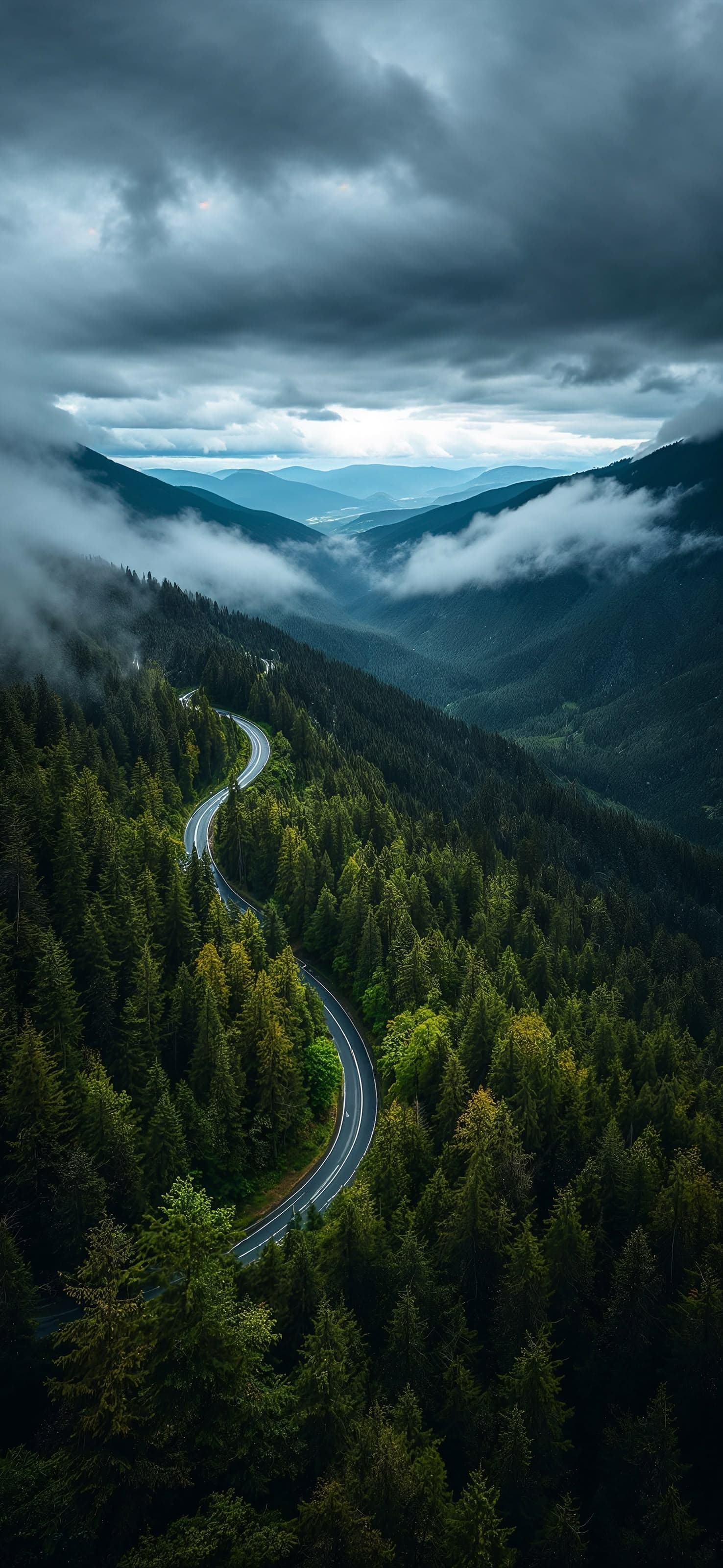 Foggy road through the mountains 3 - free phone wallpaper